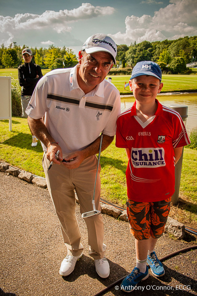 Paul McGinley with a young fan