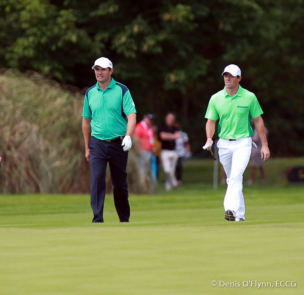 Padraig Harrington and Rory McIlroy walk up the 8th green on the first day of the Irish Open