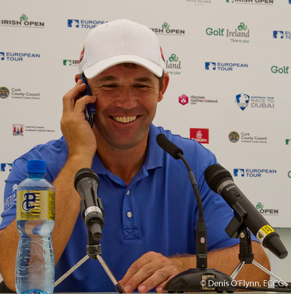 Padraig Harrington answers a reporter's phone during a Press Conference on practice day